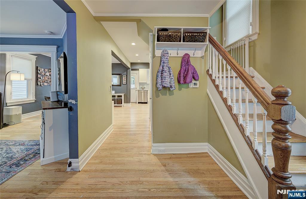 43 Llewellyn Avenue Bloomfield, NJ 07003 - Photo 11 of 25 a view of a hallway with wooden floor and staircase