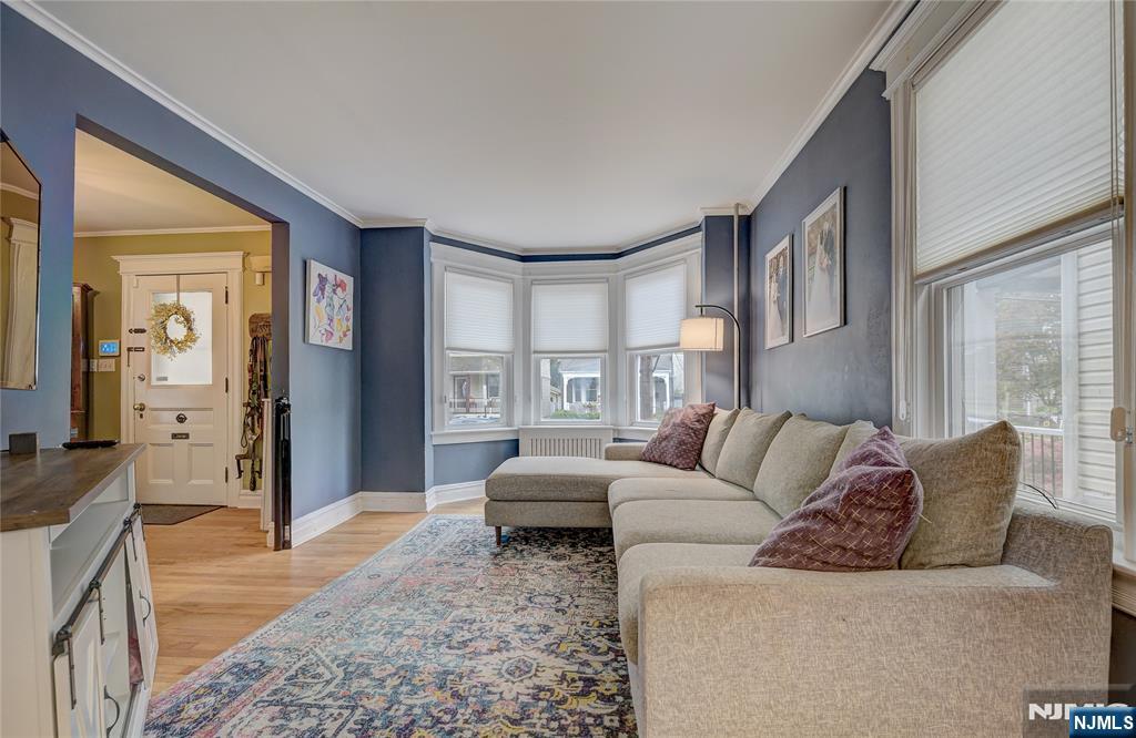 43 Llewellyn Avenue Bloomfield, NJ 07003 - Photo 3 of 25 a living room with furniture and a large window
