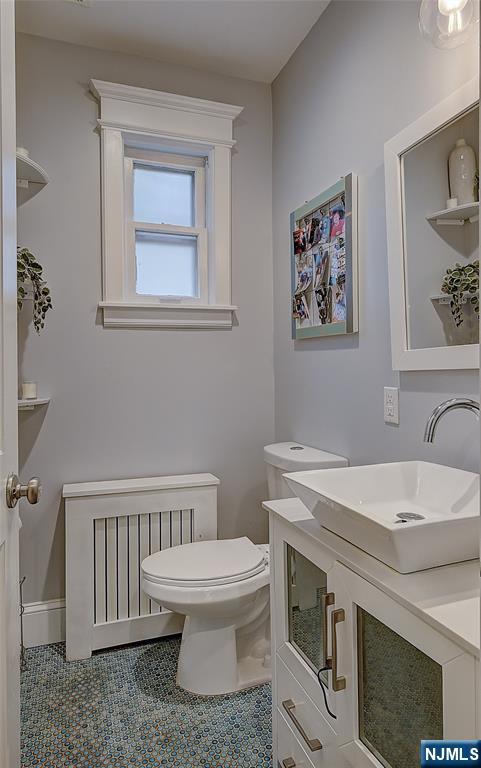 43 Llewellyn Avenue Bloomfield, NJ 07003 - Photo 10 of 25 a bathroom with a toilet a sink and a window