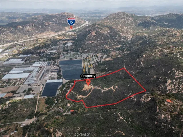 an aerial view of a houses with a yard