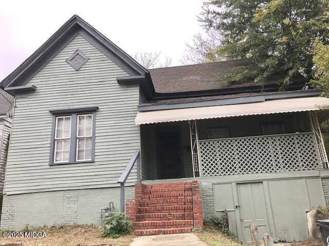 a front view of a house with wooden fence
