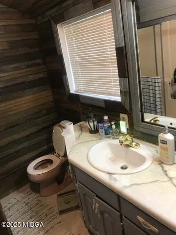 a bathroom with sink and mirror