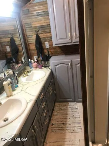 a bedroom with a bed a mirror and a window