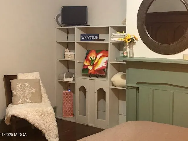 a bedroom with a bed and a lamp