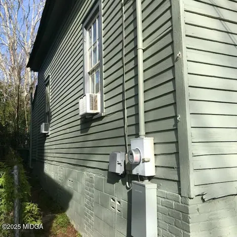 a view of a house with a tree