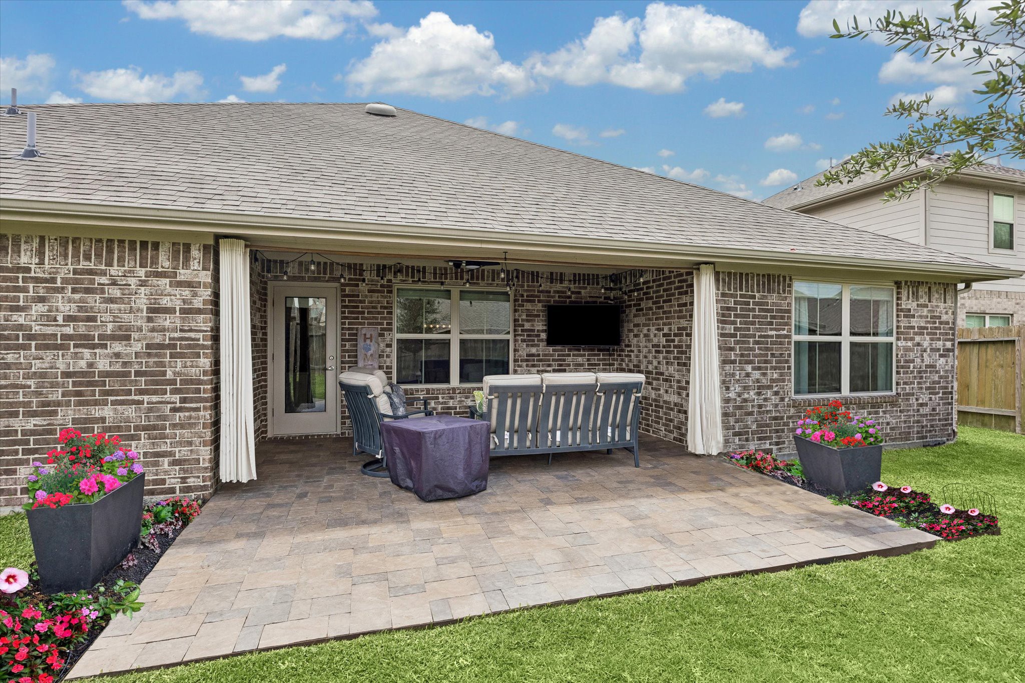 10227 Whitney Reach Drive Rosharon, TX 77583 - Photo 3 of 28 Spacious paved patio perfect for entertaining, featuring a charming all-brick exterior and extended gutters.