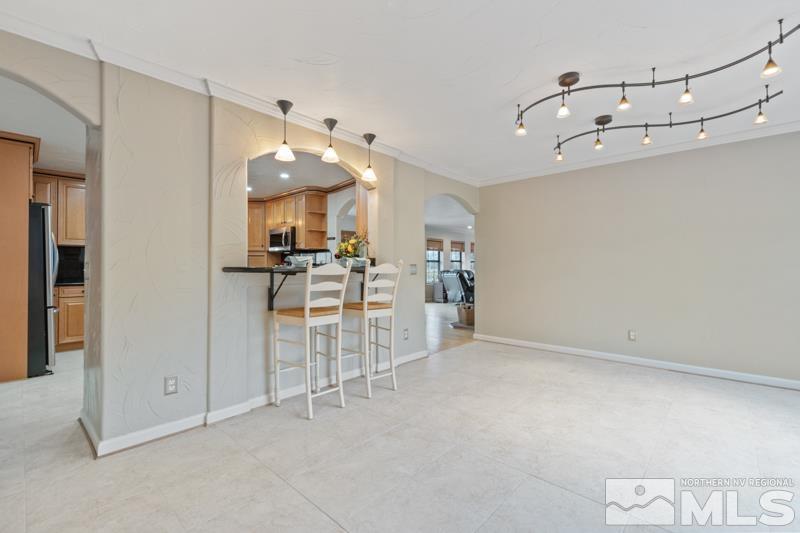 4060 Cimarron Road Fallon, NV 89406 - Photo 11 of 22 a view of a kitchen with furniture and a ceiling fan
