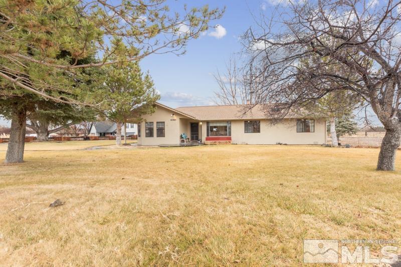 4060 Cimarron Road Fallon, NV 89406 - Photo 19 of 22 a house with trees in front of it