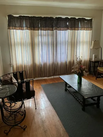 a room with furniture and a rug