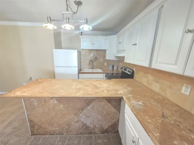 a spacious bathroom with a granite countertop sink a mirror and vanity