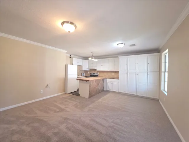 a view of a kitchen with a sink