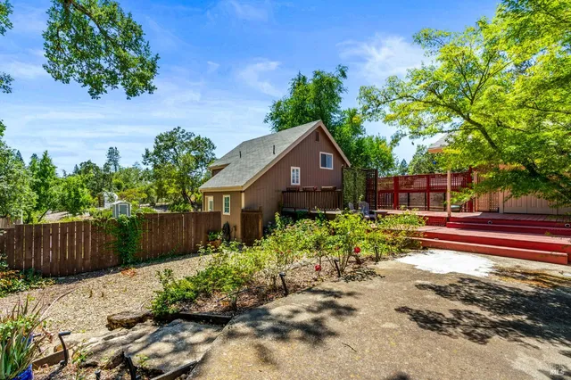 a view of a house with a yard and garage