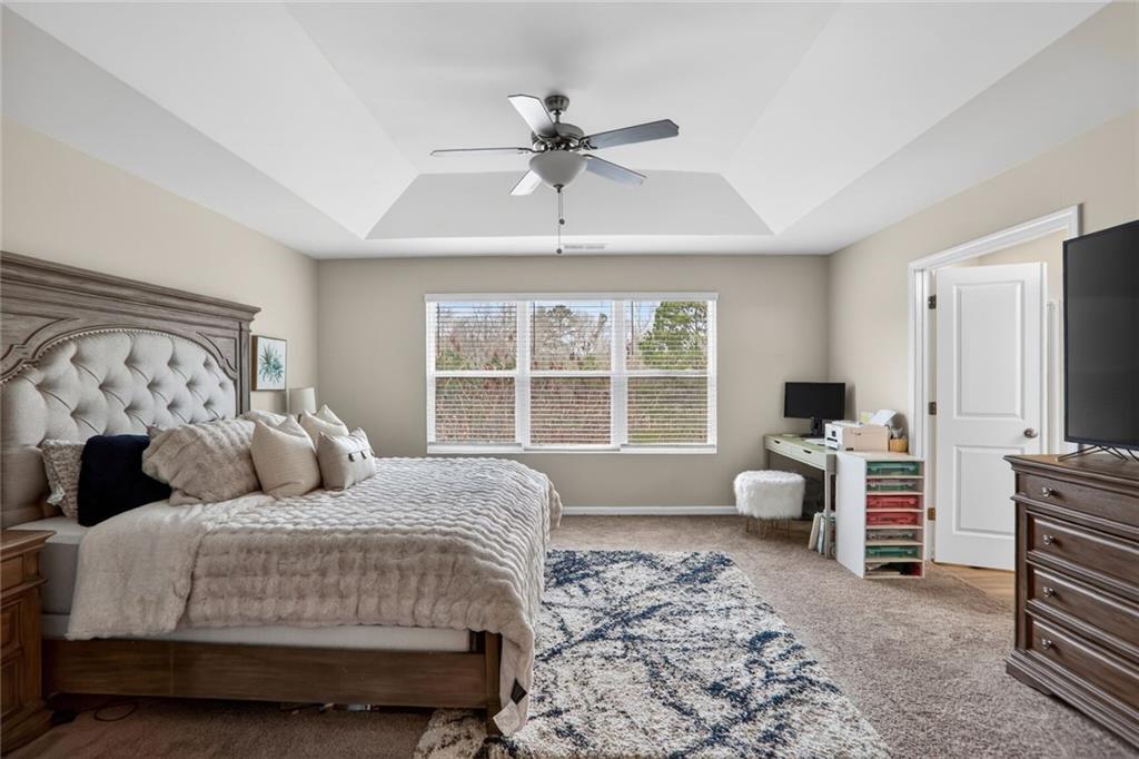 594 Summit Point Canton, GA 30114 - Photo 11 of 32 a bedroom with a bed couch and a window