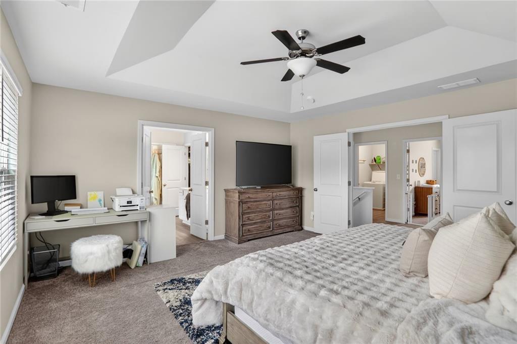 594 Summit Point Canton, GA 30114 - Photo 13 of 32 a bedroom with a bed and a flat screen tv