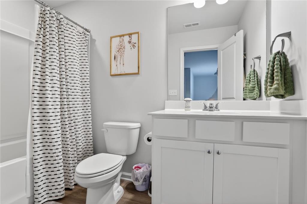 594 Summit Point Canton, GA 30114 - Photo 20 of 32 a bathroom with a sink toilet and mirror