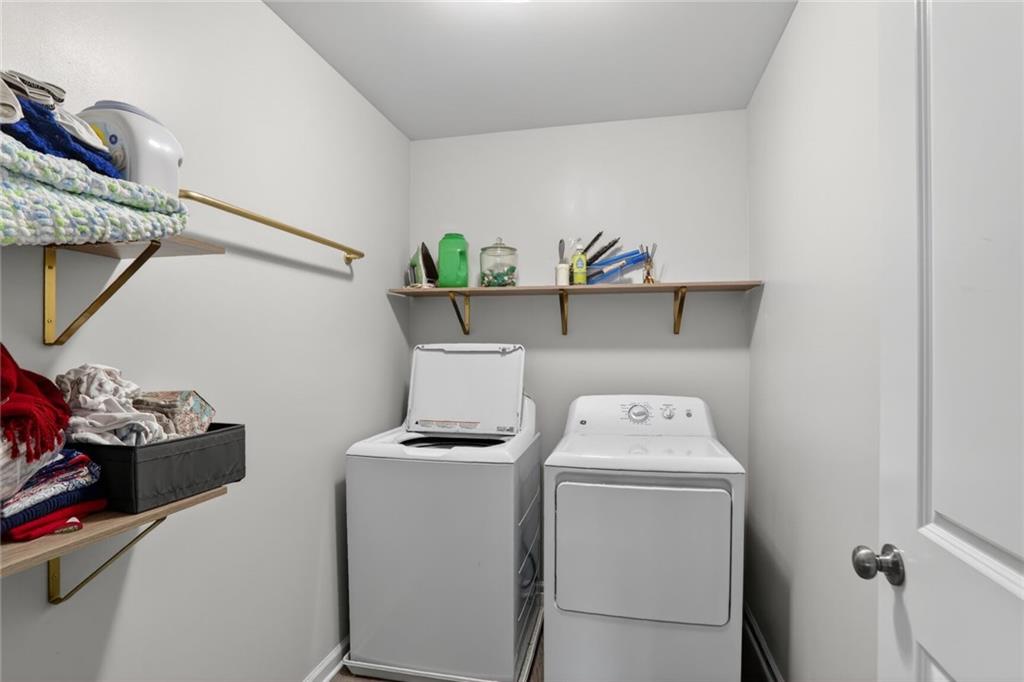 594 Summit Point Canton, GA 30114 - Photo 23 of 32 a utility room with dryer washer and other items
