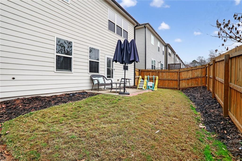 594 Summit Point Canton, GA 30114 - Photo 24 of 32 a view of house with backyard and deck