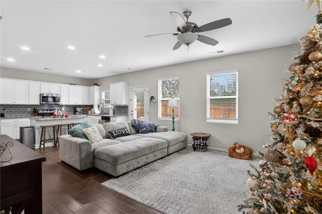 a living room with furniture and a window