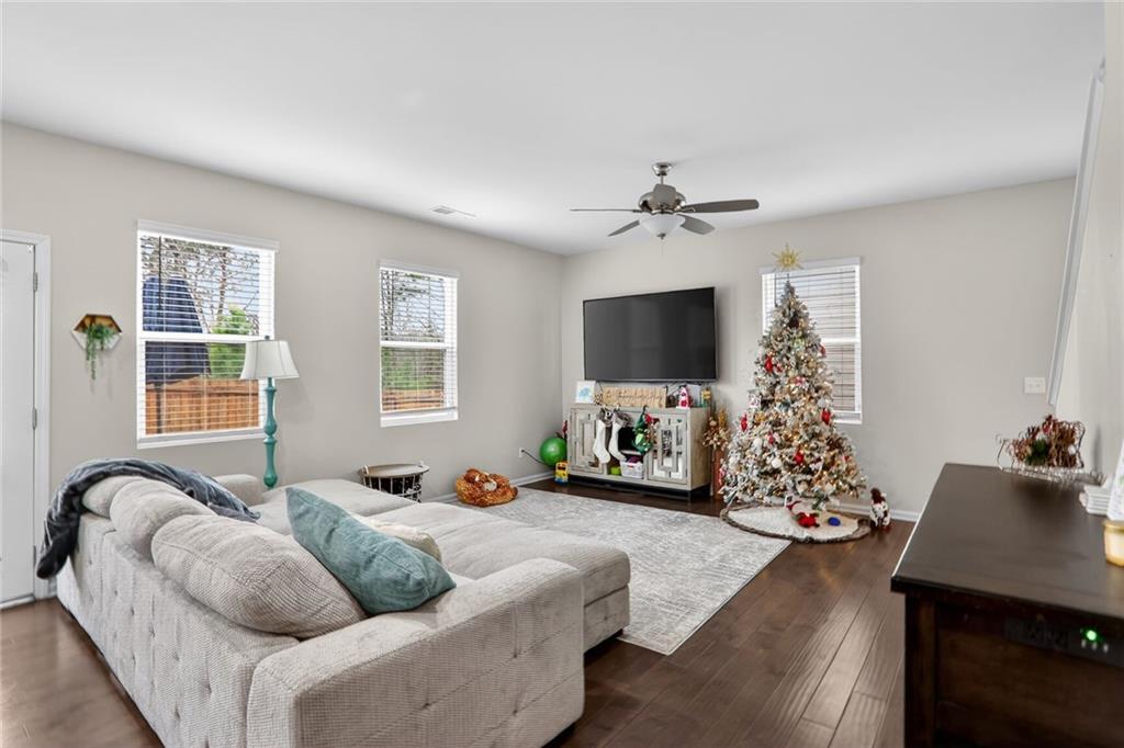 594 Summit Point Canton, GA 30114 - Photo 4 of 32 a living room with furniture fireplace and a flat screen tv
