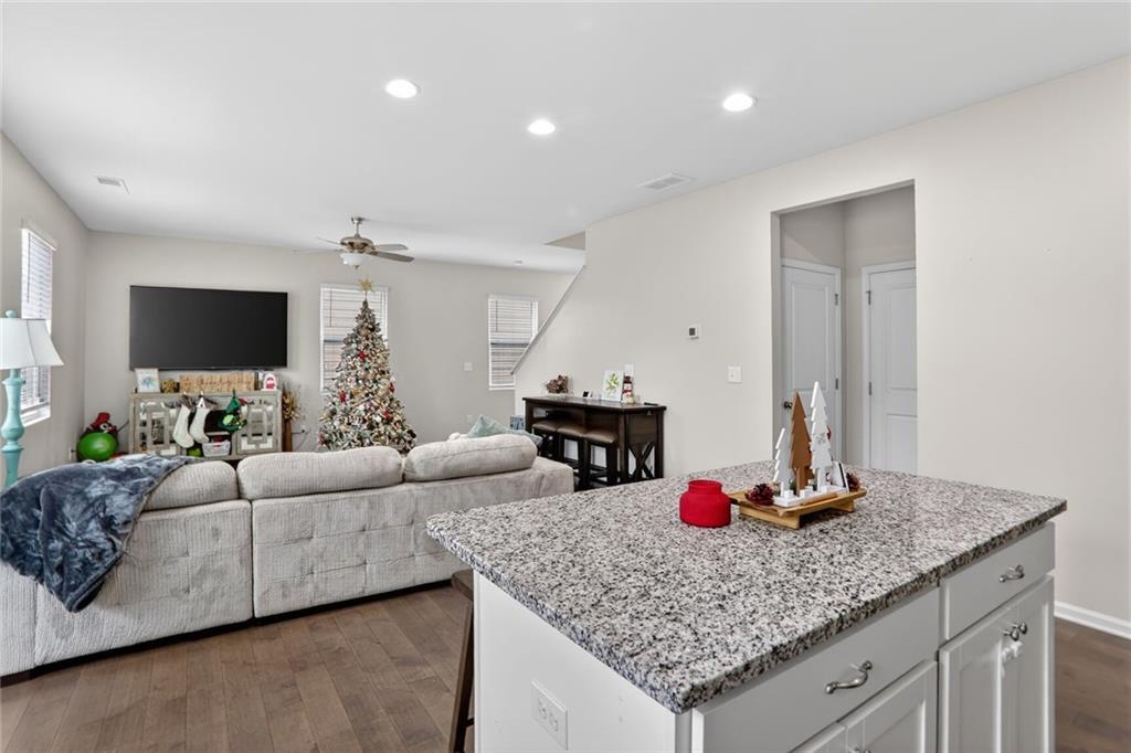 594 Summit Point Canton, GA 30114 - Photo 9 of 32 a living room with furniture and a flat screen tv