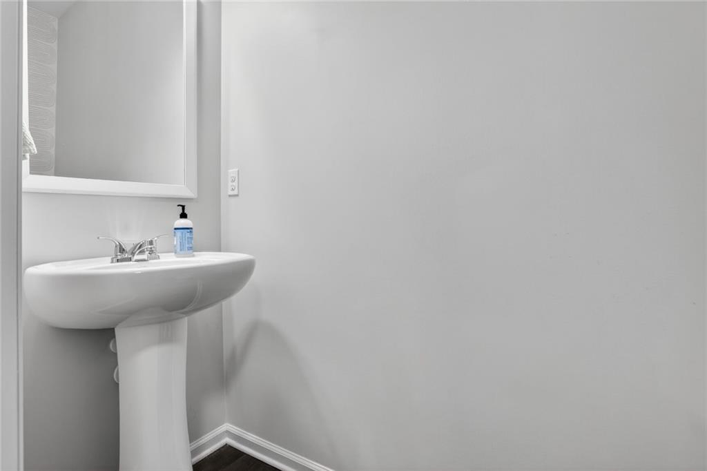 594 Summit Point Canton, GA 30114 - Photo 10 of 32 a bathroom with a sink and mirror
