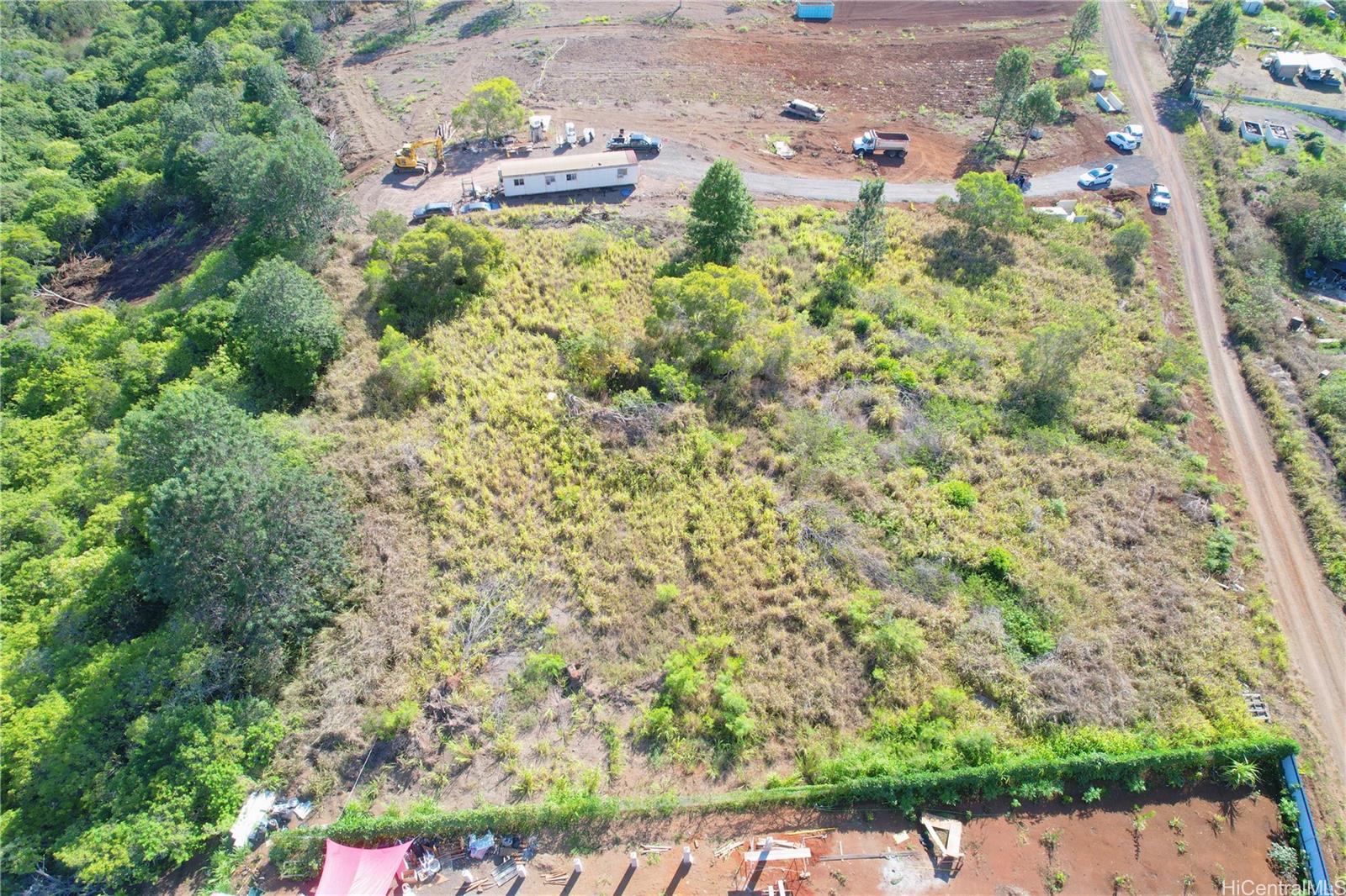 94-1100 Kunia Road, Unit 99C2 Waipahu, HI 96797 - Photo 7 of 7 an aerial view of a house with a yard