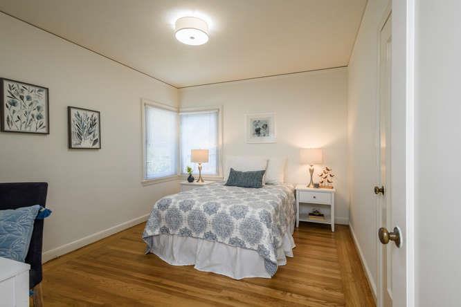 404 Dwight Road Burlingame, CA 94010 - Photo 18 of 33 a bedroom with a bed and a window