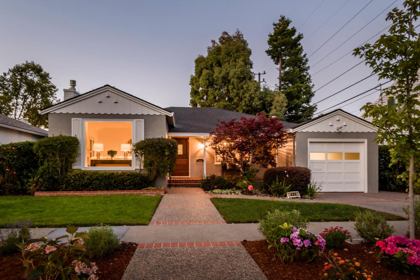 404 Dwight Road Burlingame, CA 94010 - Photo 2 of 33 a front view of a house with a garden