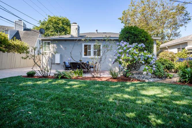 404 Dwight Road Burlingame, CA 94010 - Photo 25 of 33 a view of a chair and table in back yard of the house