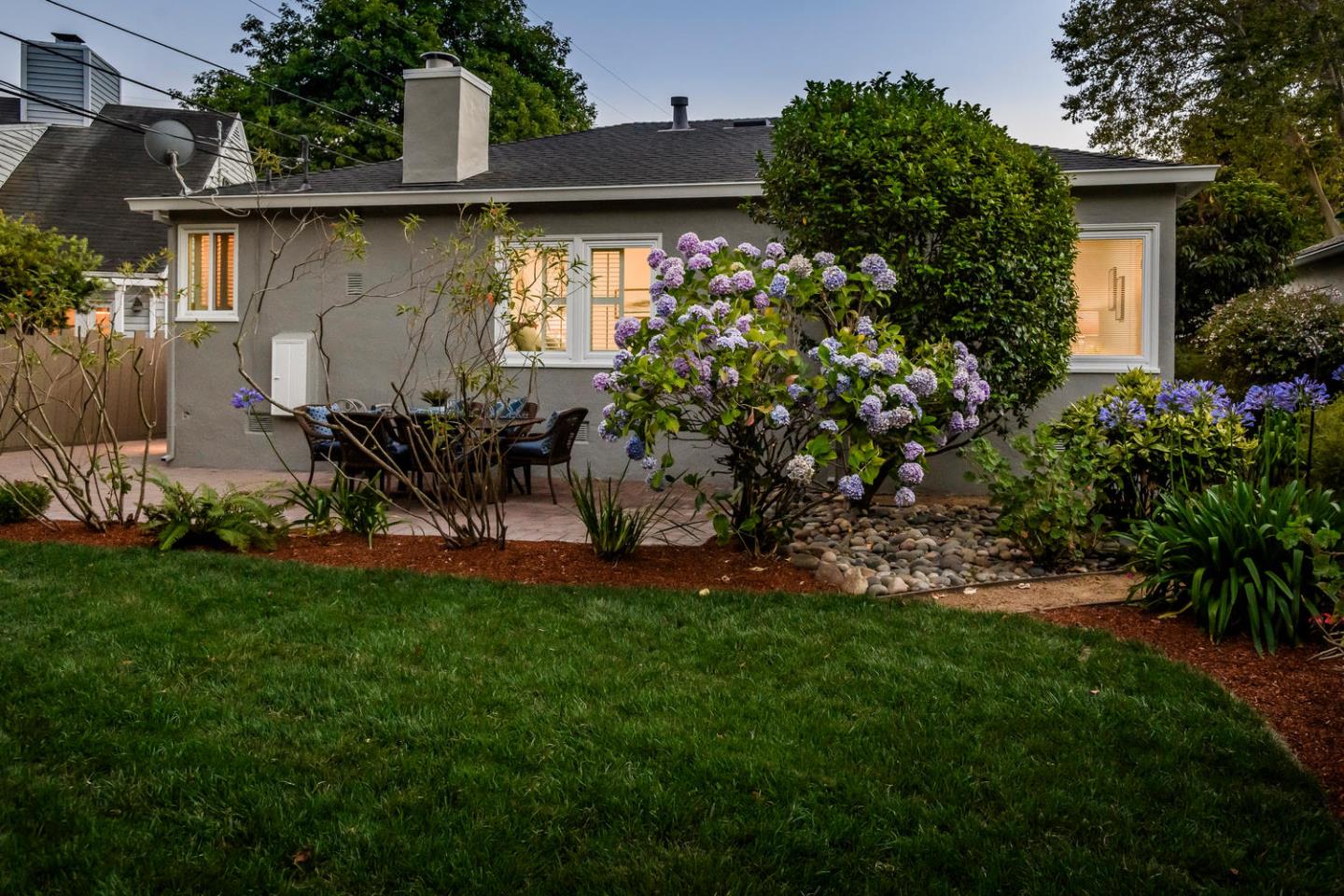 404 Dwight Road Burlingame, CA 94010 - Photo 26 of 33 a backyard of a house with table and chairs