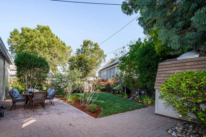 404 Dwight Road Burlingame, CA 94010 - Photo 27 of 33 a view of a patio with table and chairs and potted plants