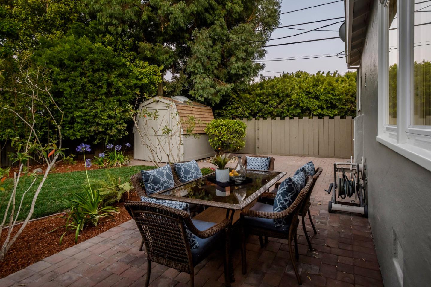 404 Dwight Road Burlingame, CA 94010 - Photo 30 of 33 a backyard of a house with table and chairs