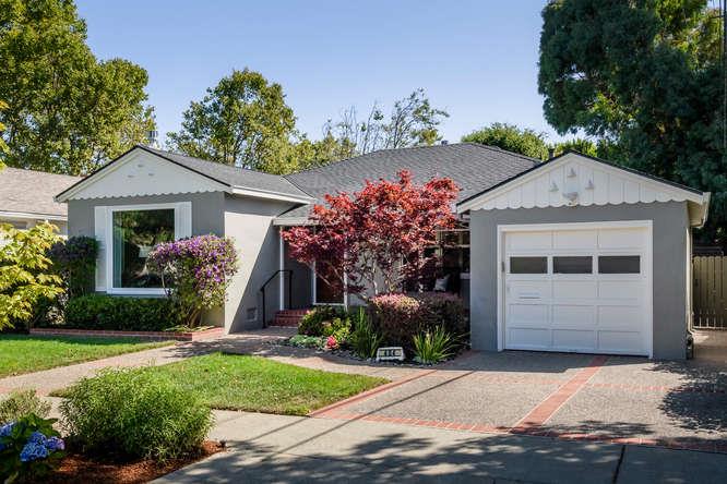 404 Dwight Road Burlingame, CA 94010 - Photo 3 of 33 a front view of a house with a yard and garage
