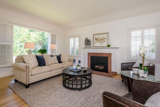 404 Dwight Road Burlingame, CA 94010 - Photo 7 of 33 a living room with furniture a fireplace and a large window