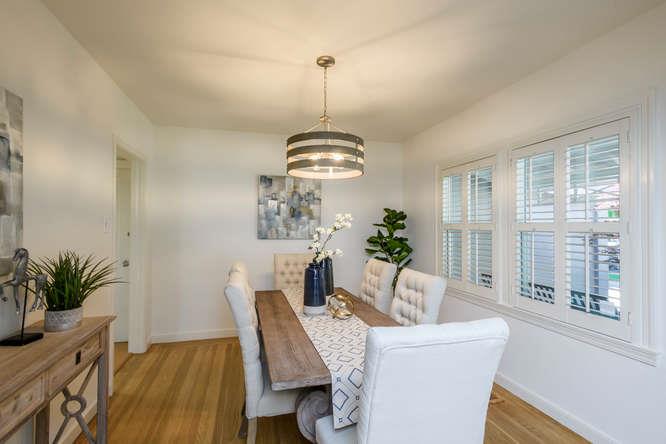 404 Dwight Road Burlingame, CA 94010 - Photo 9 of 33 a dining room with furniture a chandelier and wooden floor