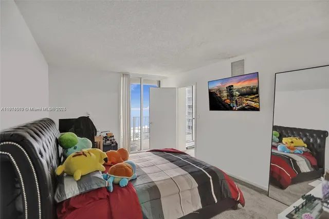 a bedroom with a bed and a book shelf