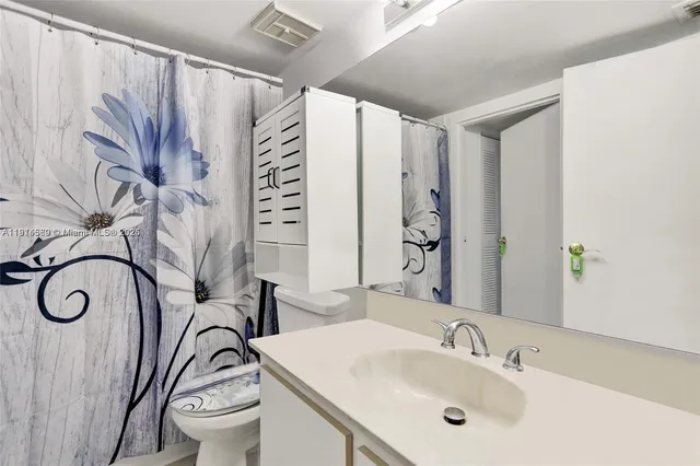 a kitchen with stainless steel appliances a refrigerator and a stove