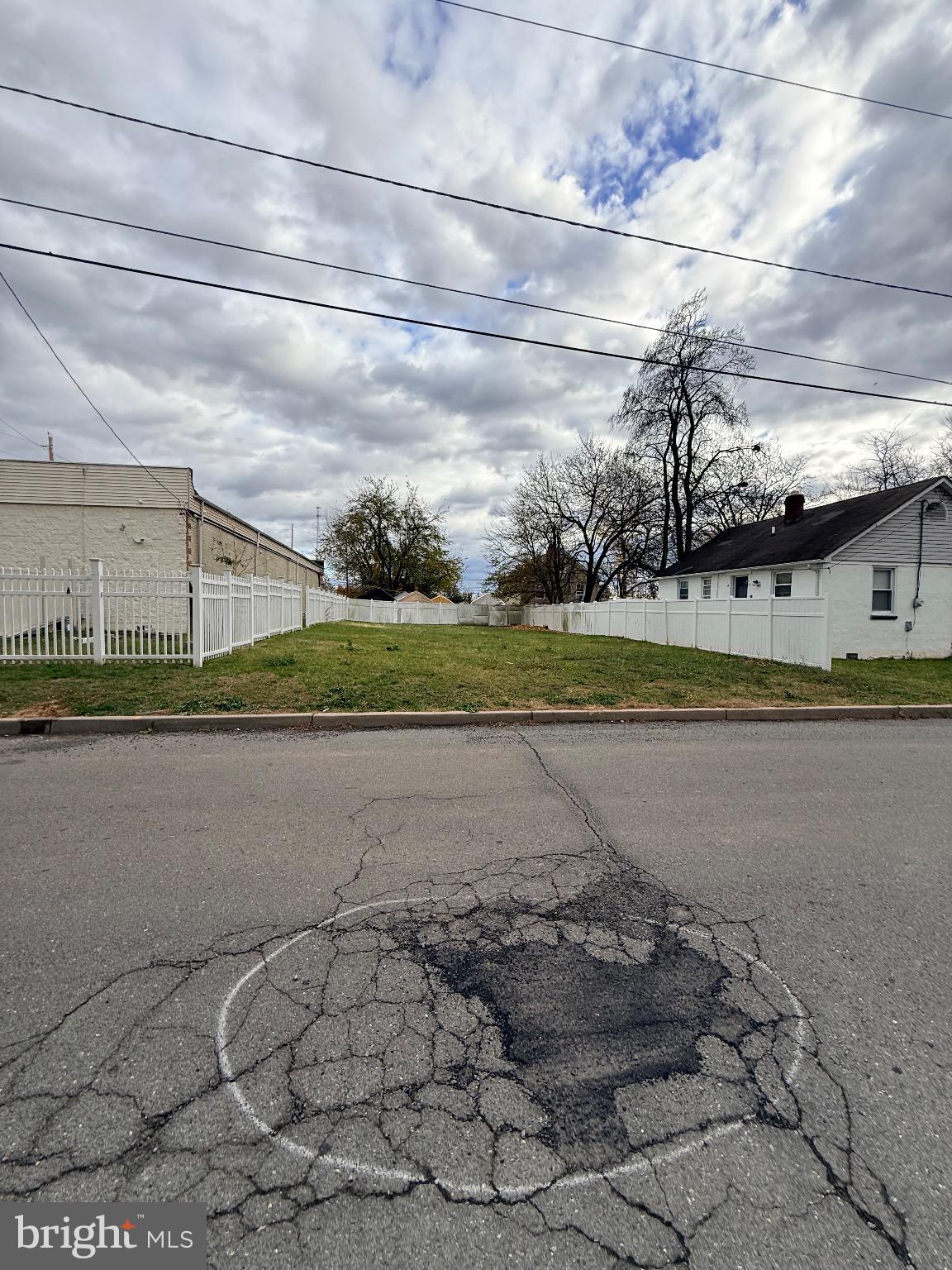 112 Fuller Street Somerset, NJ 08873 - Photo 7 of 11 a view of a big yard with a large trees