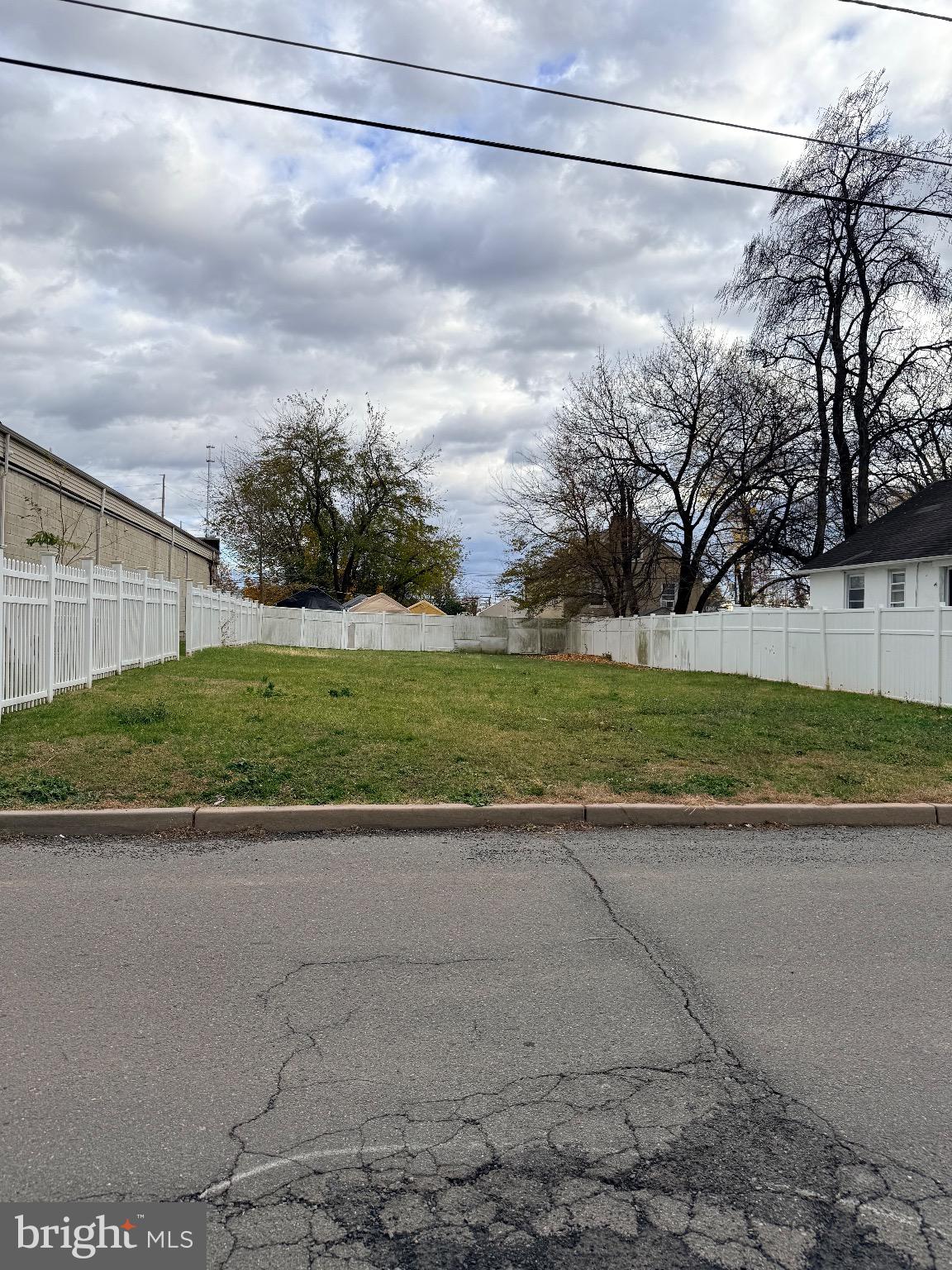 112 Fuller Street Somerset, NJ 08873 - Photo 8 of 11 a view of a yard with wooden fence