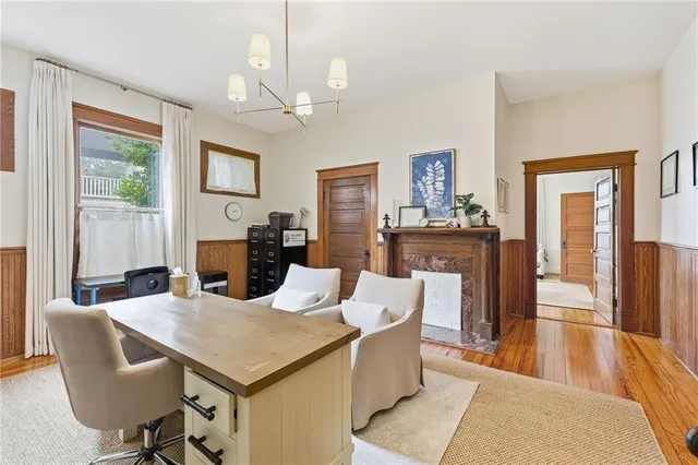 a view of a dining room with furniture window and wooden floor