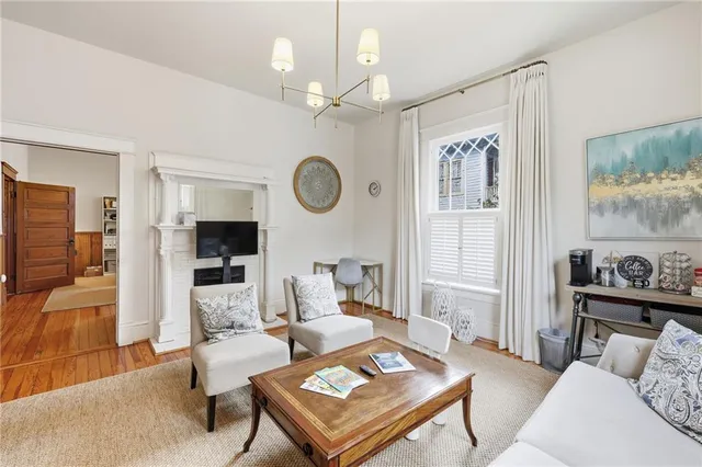 a living room with furniture and a clock