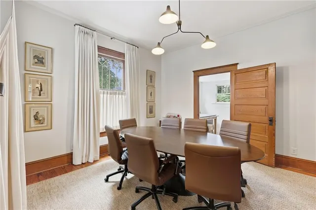 a view of a dining room with furniture window and wooden floor
