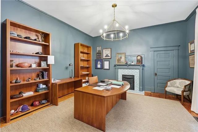 a living room with furniture fireplace and window
