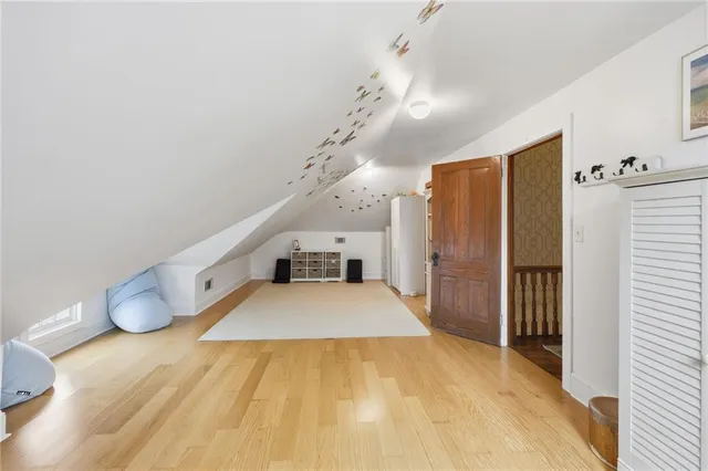 a spacious bathroom with a double vanity sink and a large mirror