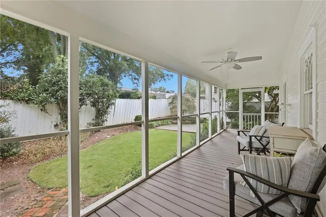 a view of a balcony with chair and table
