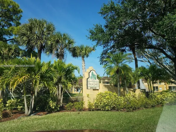 a view of a garden with a house