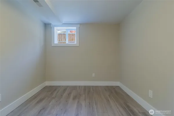 a room and a window with wooden floor