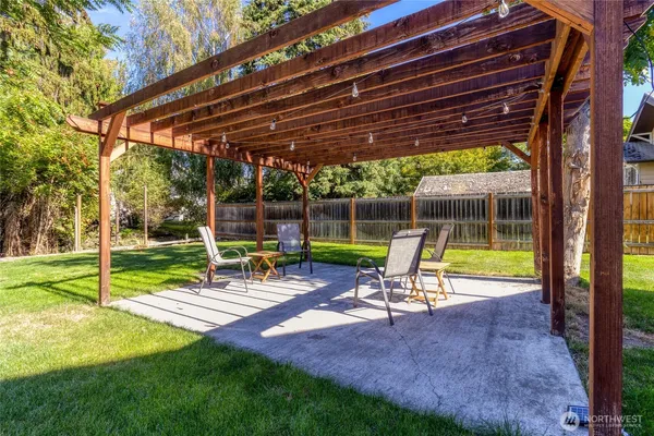 a view of a park with chairs and a small yard
