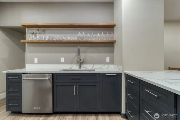 a kitchen with a sink and cabinets