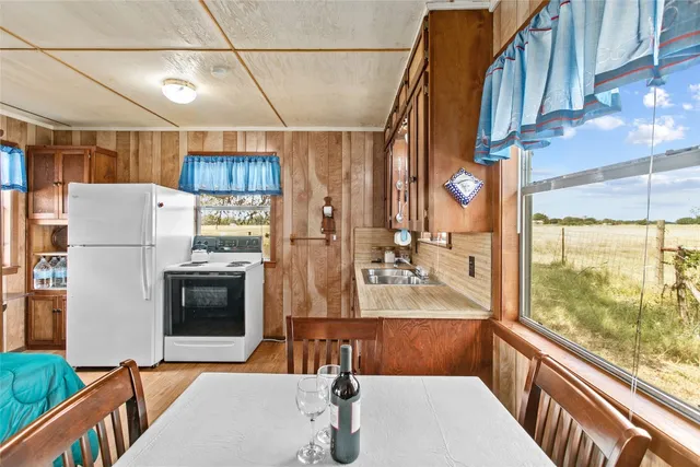 a view of living room kitchen and utility room